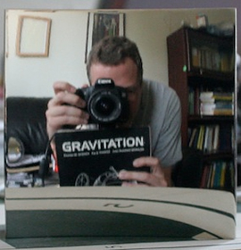 R. Andrew Hicks takes a photo of himself in the non-reversing mirror he invented.