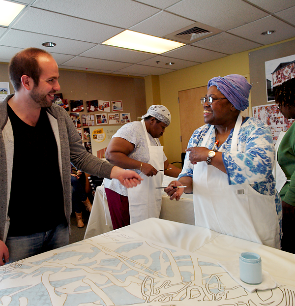 Artist Ben Volta interacts with participants in the Porch Light program at Drexel's 11th Street health center. Photo by Lynn Johnson