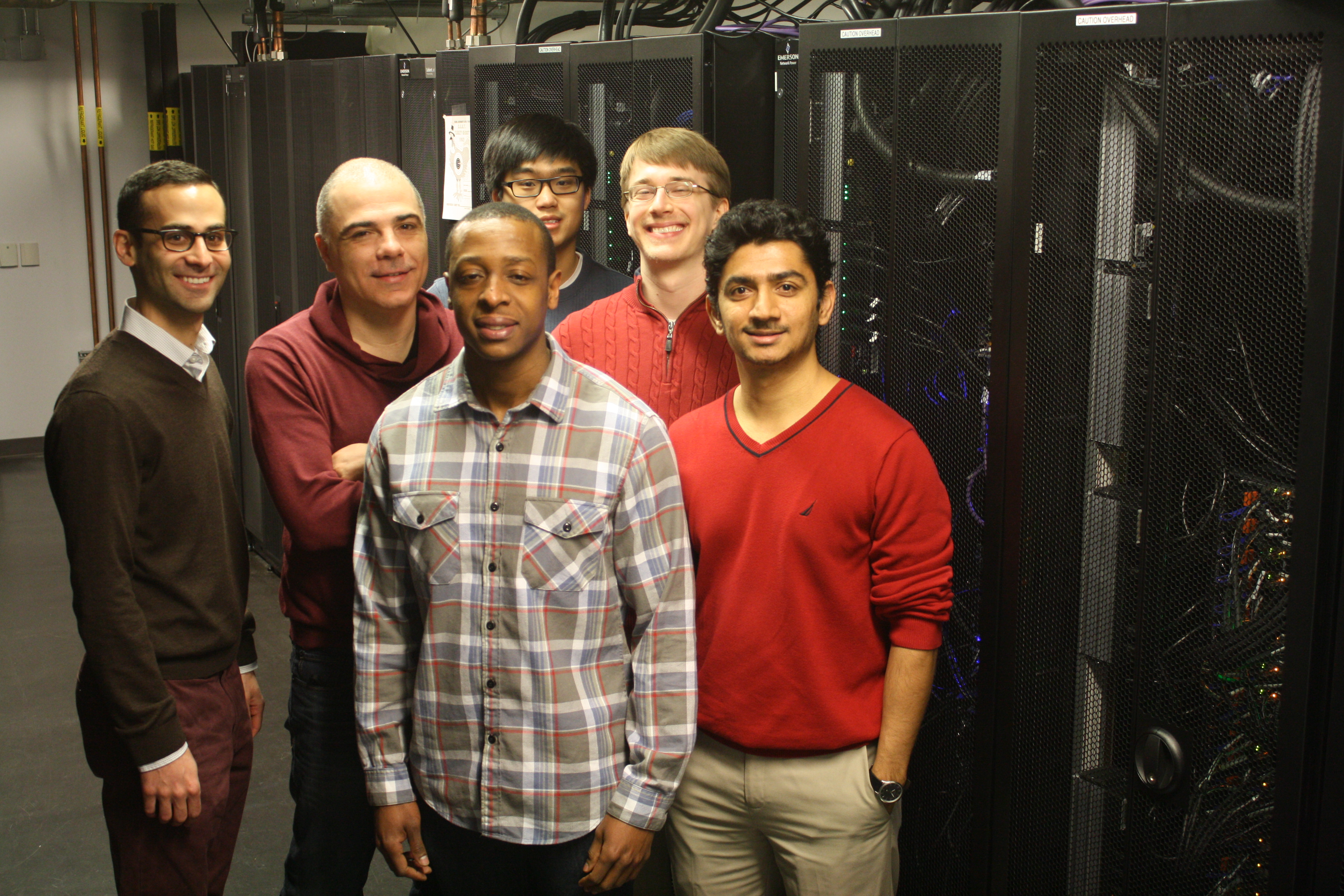 Members of the Materials Theory & Design Group in the University Research Computing Facility (URCF). From Left to Right and back to front:  Paul Cheng (Undergraduate) James Rondinelli, Danilo Puggioni (Post-doc), Joshua Yong (PhD student) Nenain Charles (PhD student), Prasanna Balachandran (Post-doc)