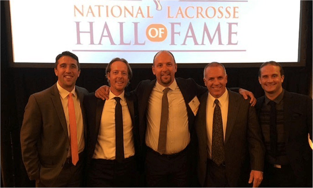 Drexel Men's Lacrosse Head Coach Brian Voelker, center, took his place among the greats in the sport as he was inducted into the National Lacrosse Hall of Fame.