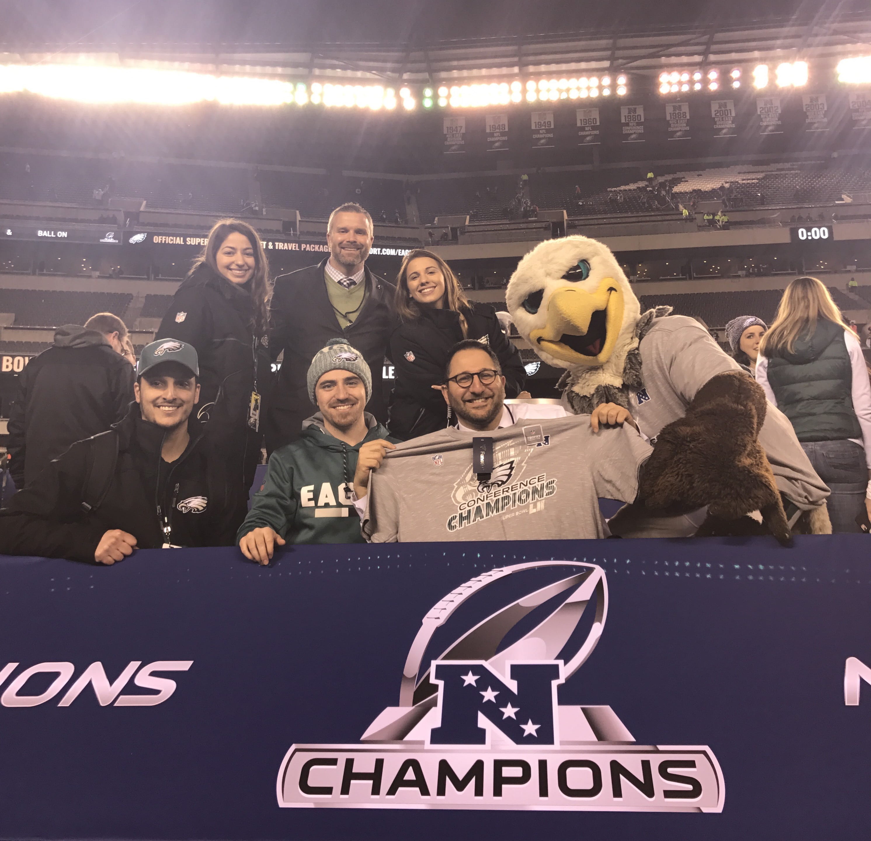 Victoria Louca, top left, celebrating with Swoop and the Eagles' marketing team at Lincoln Financial Field.