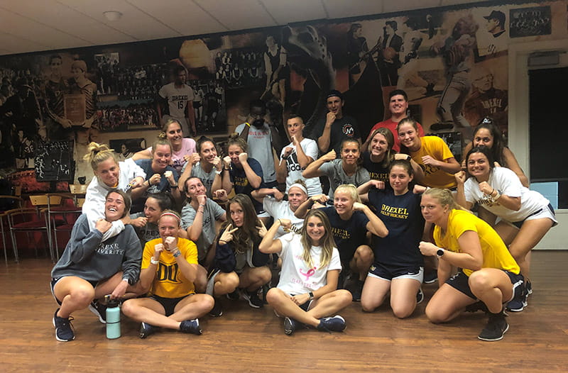 Members of the Drexel Field Hockey team pose with Drexel Police officers after taking the two-hour self-defense class.