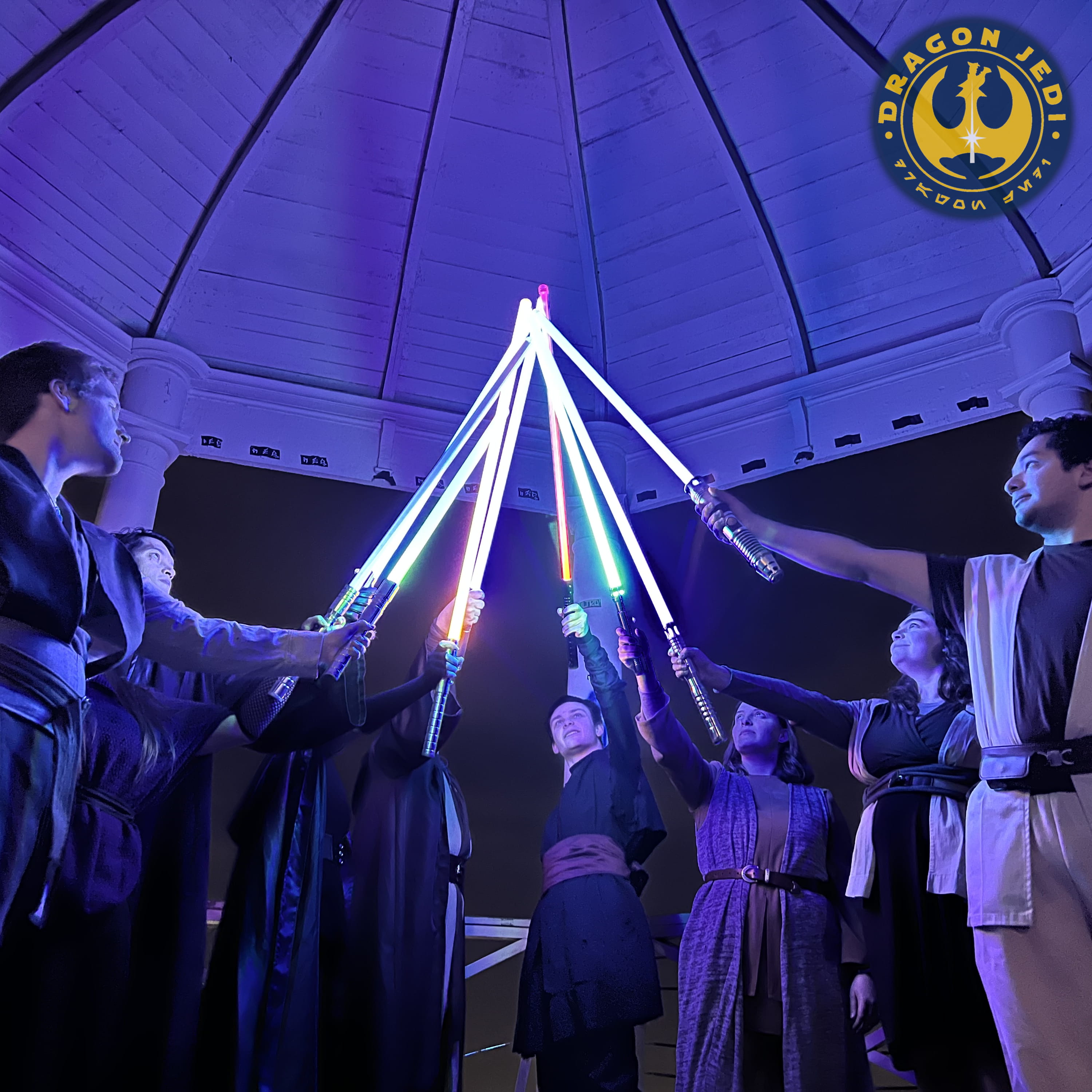 A group of Drexel Dragon Jedi raise their lightsabers