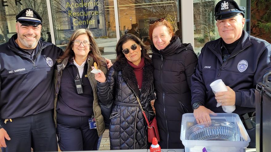 Some of the DPS crew posing with Drexel alumni, who stopped by to say hello at the recent Cookies With Cops event!]