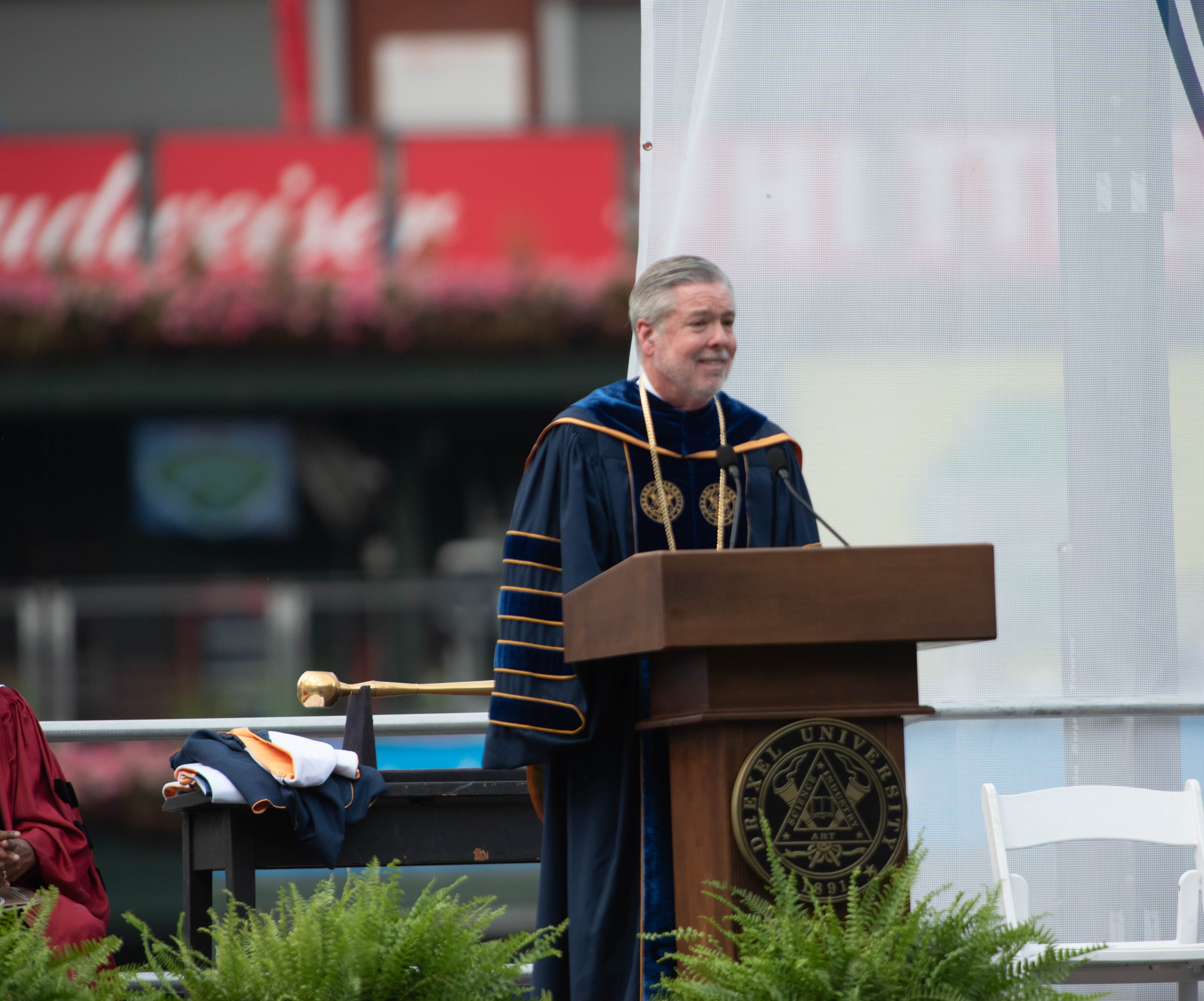 President John Fry at the podium at Commencement.