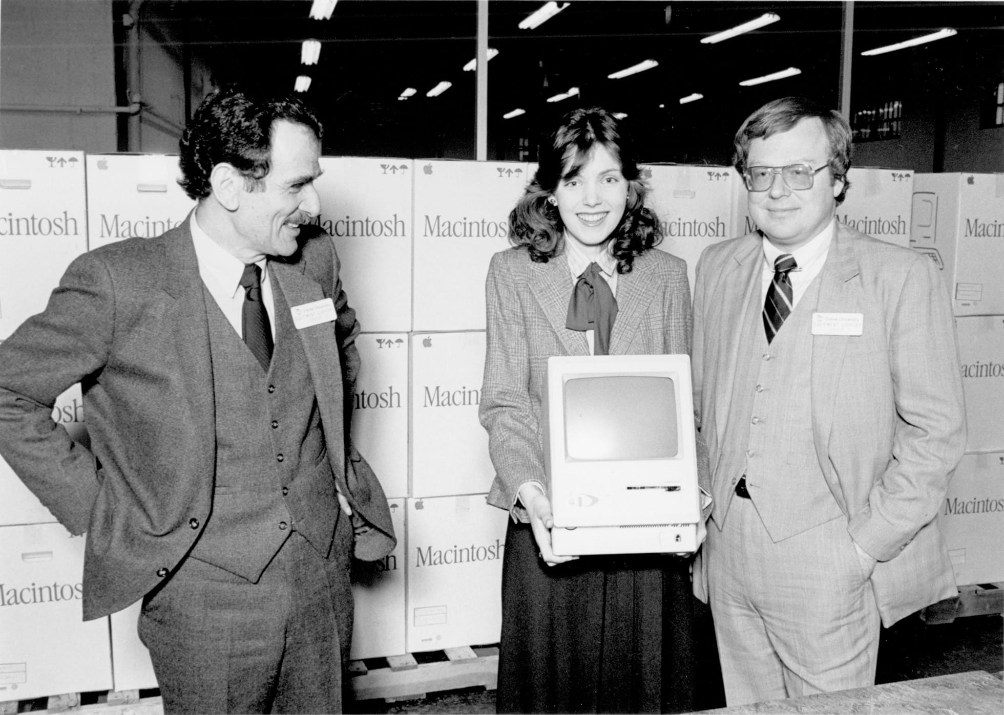 Vice President for Academic Affairs Bernie Sagik, left, and Assistant Vice President for Academic Affairs and Drexel Microcomputing Program Director Brian Hawkins, right, with a Drexel student on a distribution day of the Macintosh computers in March 1984. Photo courtesy Drexel University Archives.