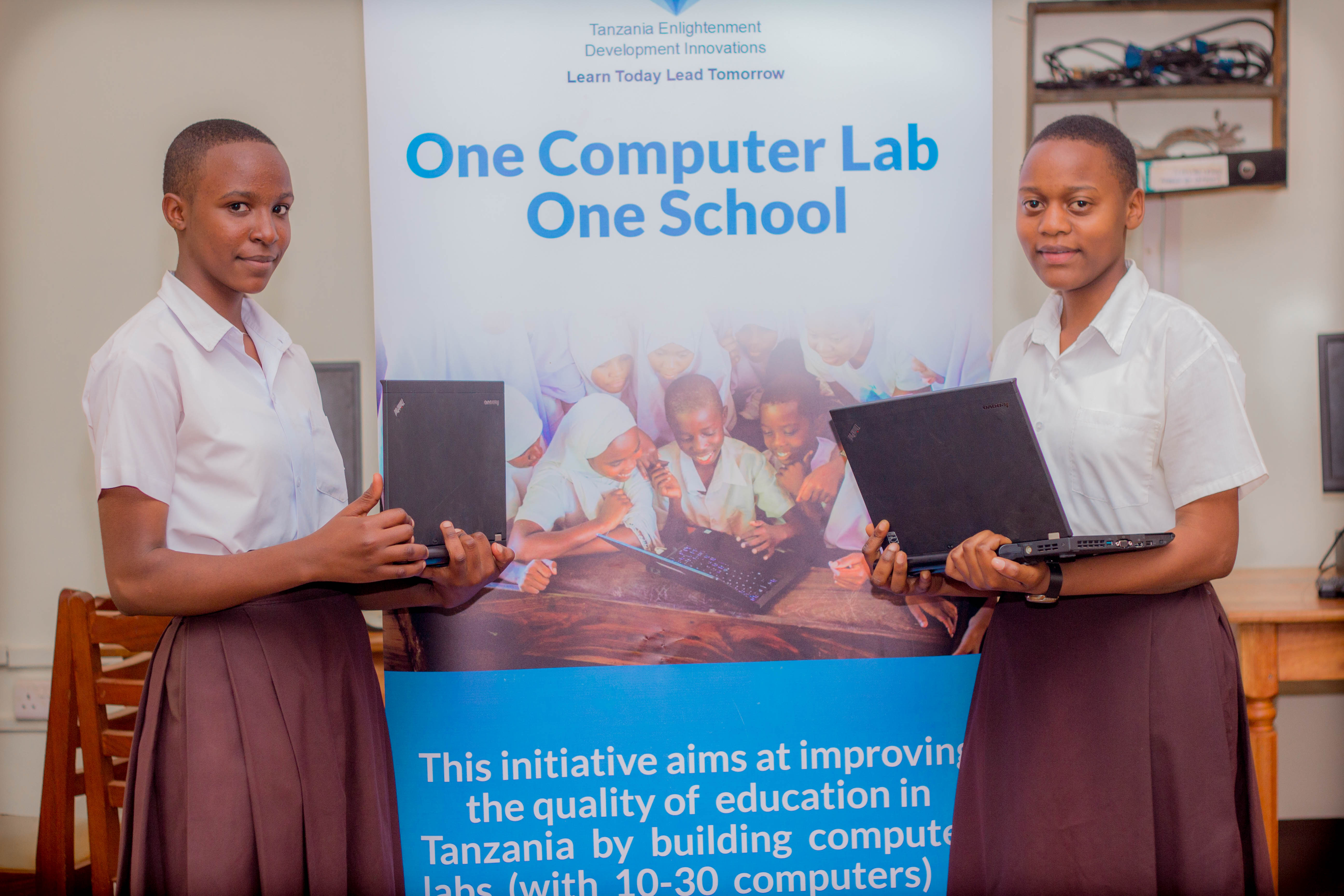Two students in the Tanzania computer lab holding laptops refurbished and donated by TechServ that were brought over through Drexel’s ICA. Photo courtesy Senior Director of Education Abroad Ahaji Schreffler, who taught the ICA.