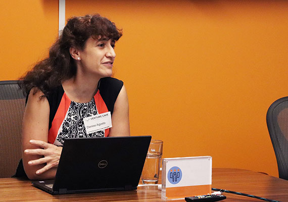 Photo of Professor Denise Agosto presenting with laptop