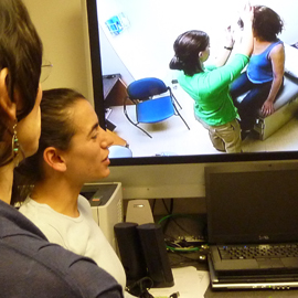 Simulation faculty watching monitor