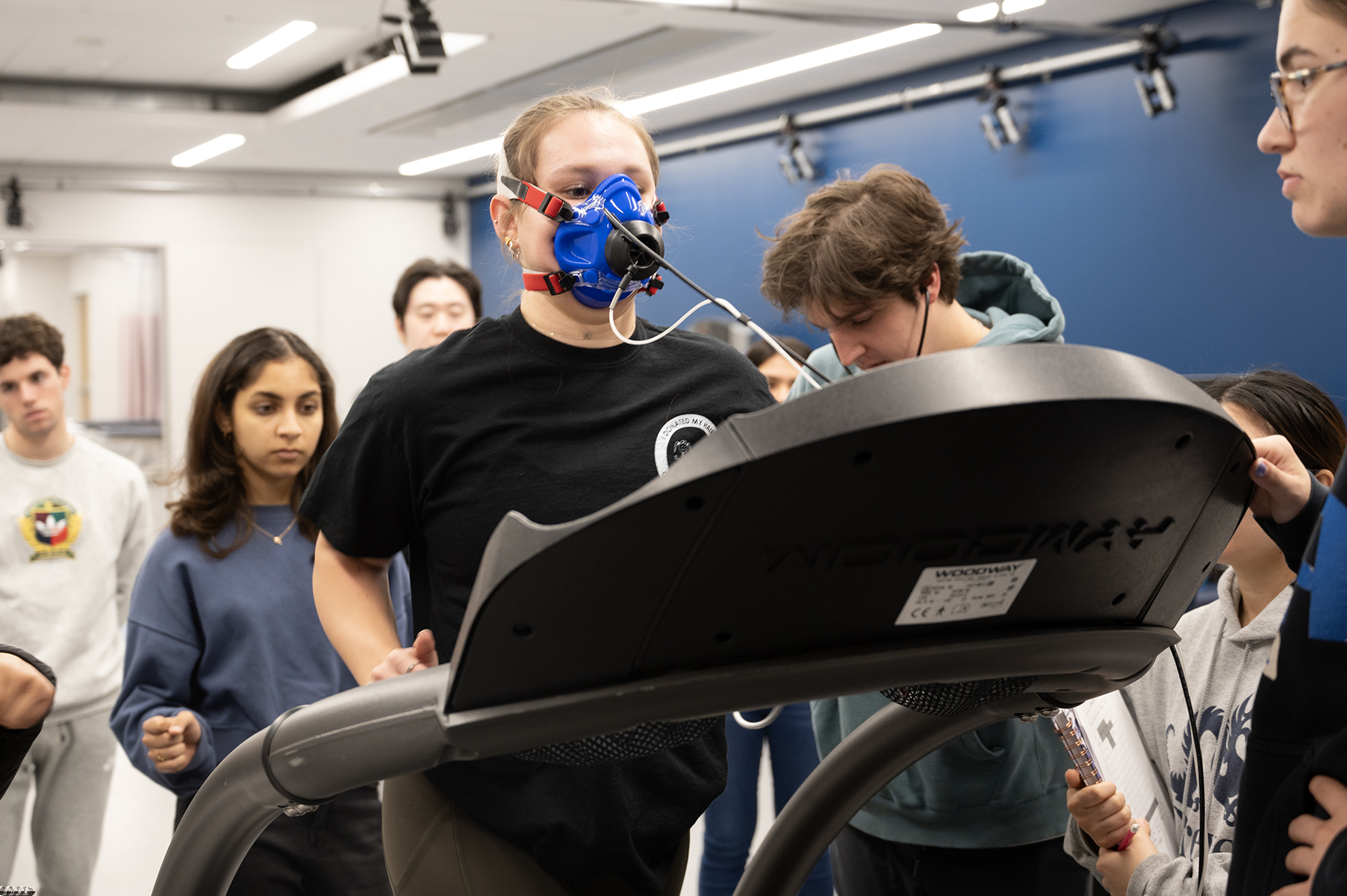 students observe student on treadmill