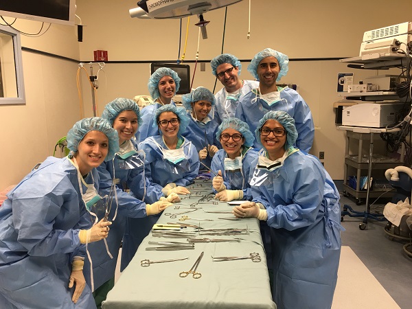 Hope Cline with fellow physician assistant students in scrubs