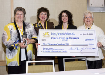 big check and 4 nursing professionals