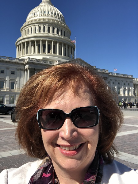 Michele Hillman, DNP, Senior Director, Case Management, Care Management and Clinical Documentation Improvement for the Children’s Hospital of Philadelphia, standing in front of the Capitol building in D.C.