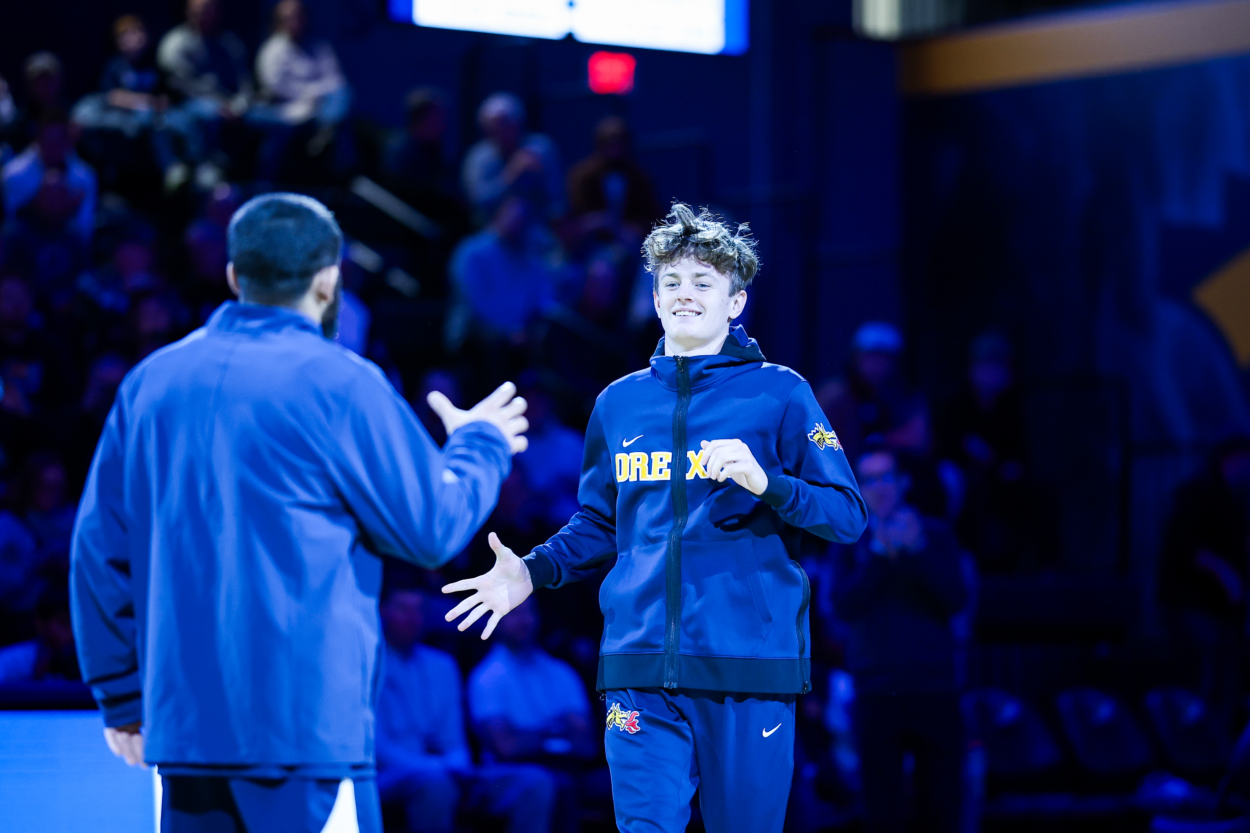 Nursing Student Patrick Kelly coming out of the stadium tunnel for wrestling match