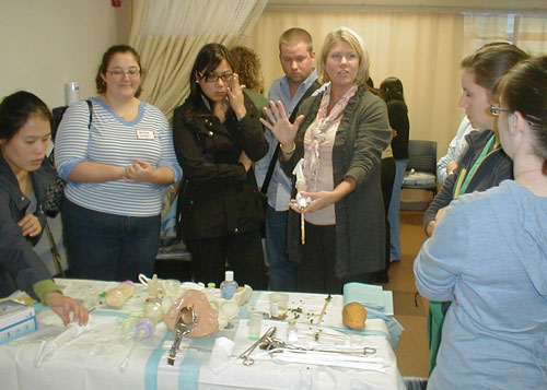 simulation faculty demonstrating to group