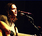 Young man playing guitar.