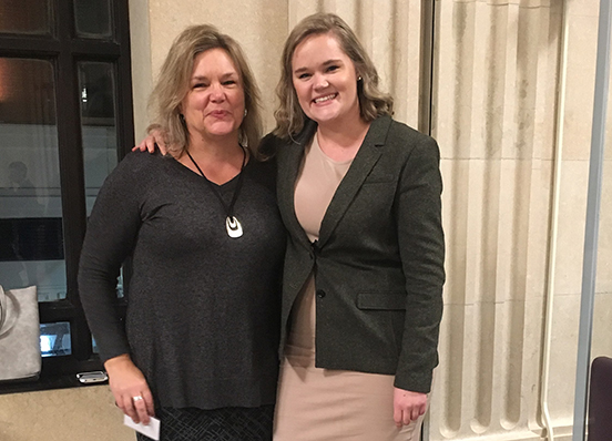 Cassie Grainge, right, receives award for outstanding service from the Philadelphia Bar Association's Public Interest Section
