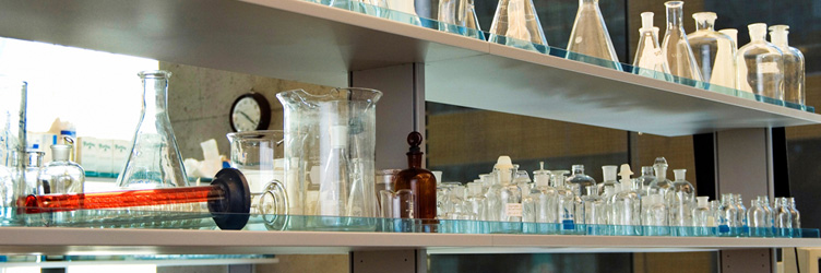 Lab bench with glass beakers and flasks.