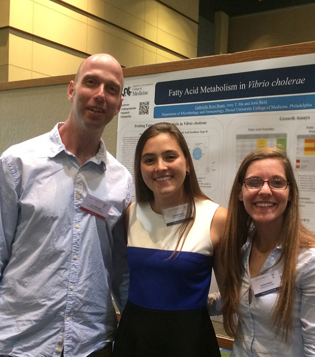 Joris Beld, PhD, Assistant Professor at Drexel University College of Medicine (left), with his lab's Summer Undergraduate Research Fellow, Gabrielle Rose Beam (middle), and undergraduate volunteer, Rachael Wilson (right), at Discovery Day 2016.