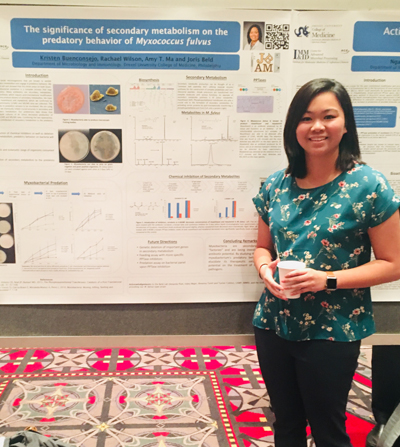 Kristen Buenconsejo with her award-winning poster, 'The Significance of Secondary Metabolism on the Predatory Behavior of Myxococcus fulvus'