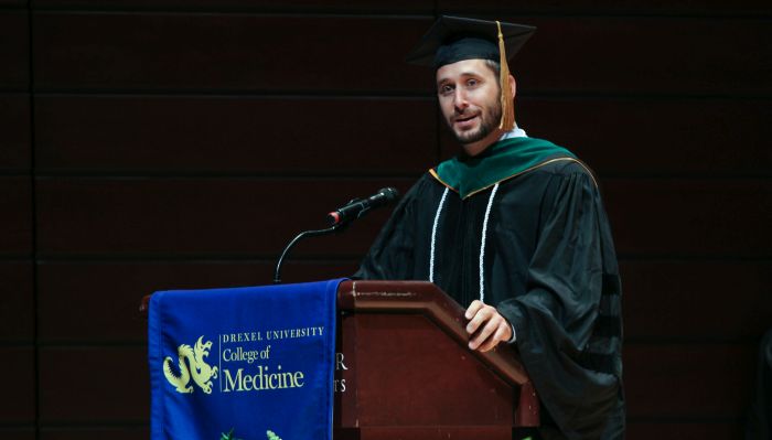 IHS alum Stephen Rogers giving the Drexel College of Medicine student commencement speech in May 2019
