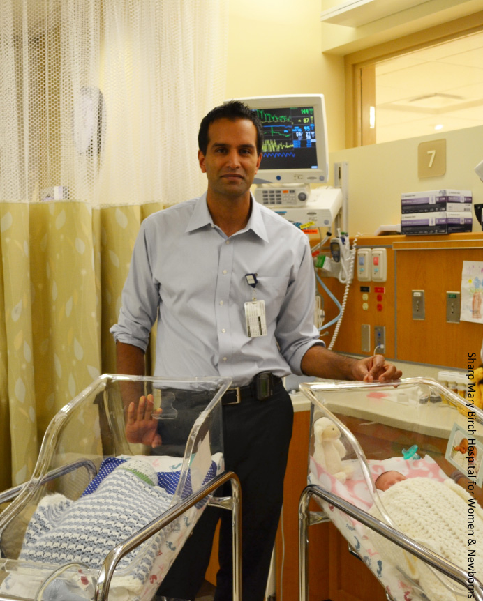 Anup Katheria, MD, with two newborns.