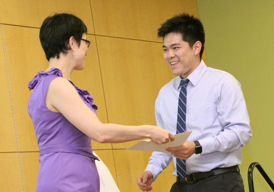 James Li receives the Society for Academic Emergency Medicine Award from Karima Sajadi-Ernazarova, MD.