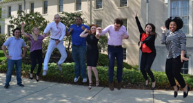 Child/adolescent psychiatry fellows jumping outside Friends Hospital