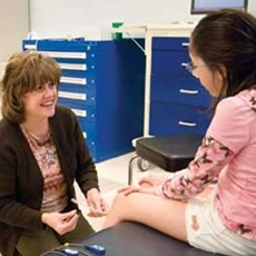 therapist facing girls knees