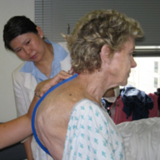 Senior patient exam of back