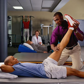 physical therapist and patient