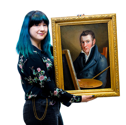 Girl holding a painting.