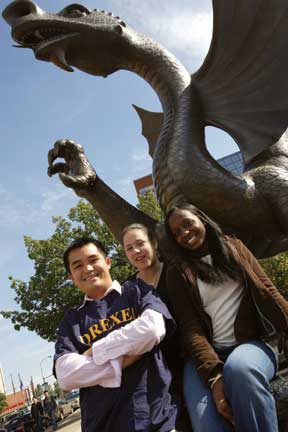 Students posing with Mario the Magnificent statue