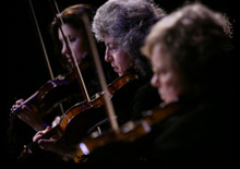 Photopgraph of three violinists from Chamber Ensemble