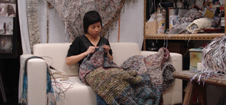 Photographs of Movana Chen knitting paper