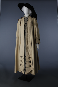 Ecru coat with tassels over striped day dress