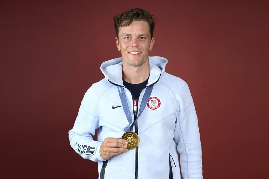Photo of Justin Best holding 2024 Olympic Gold Medal