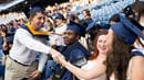 Students shaking hands in the stands