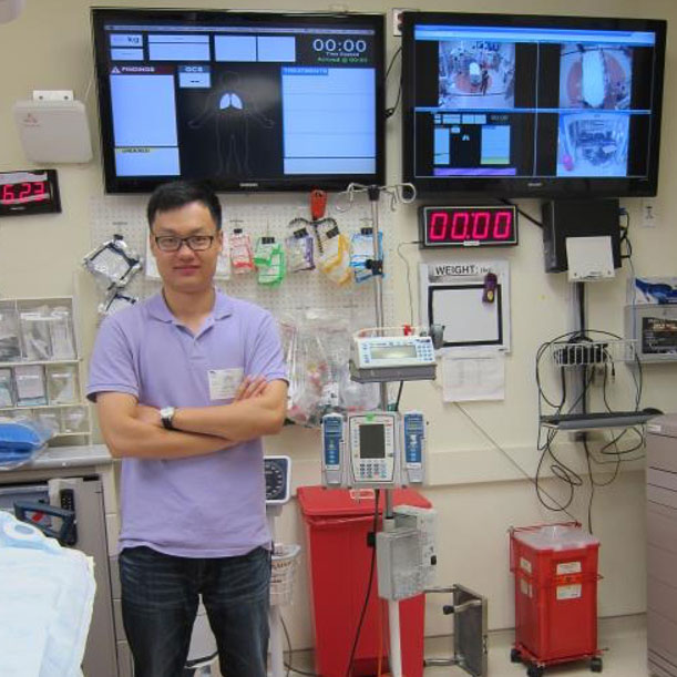 Zhan Zhang standing in trauma room at a hospital