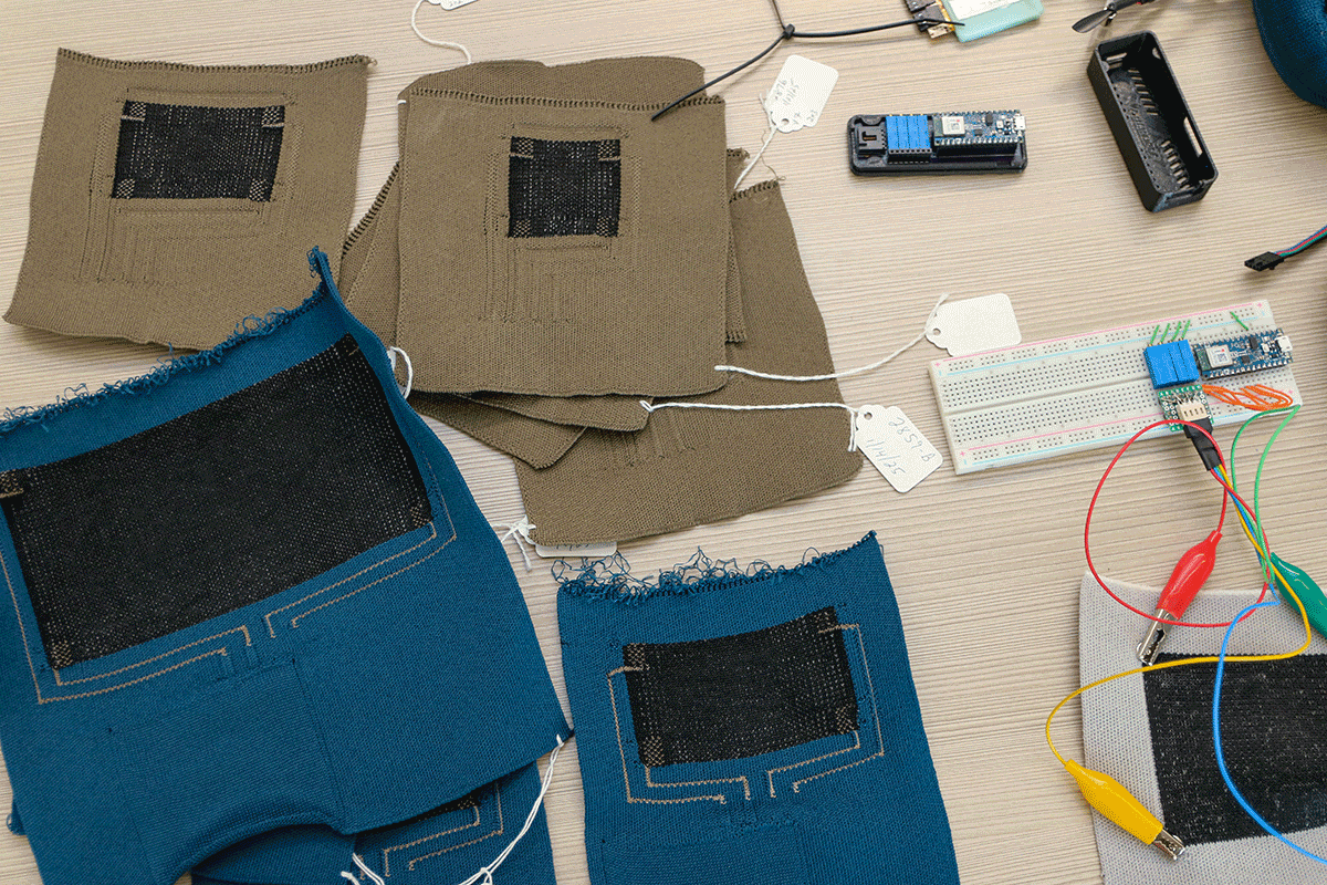Blue and gray smart fabrics laying on a table with other hardware