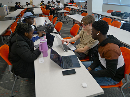 A Philly Codefest 2025 team working on their project.