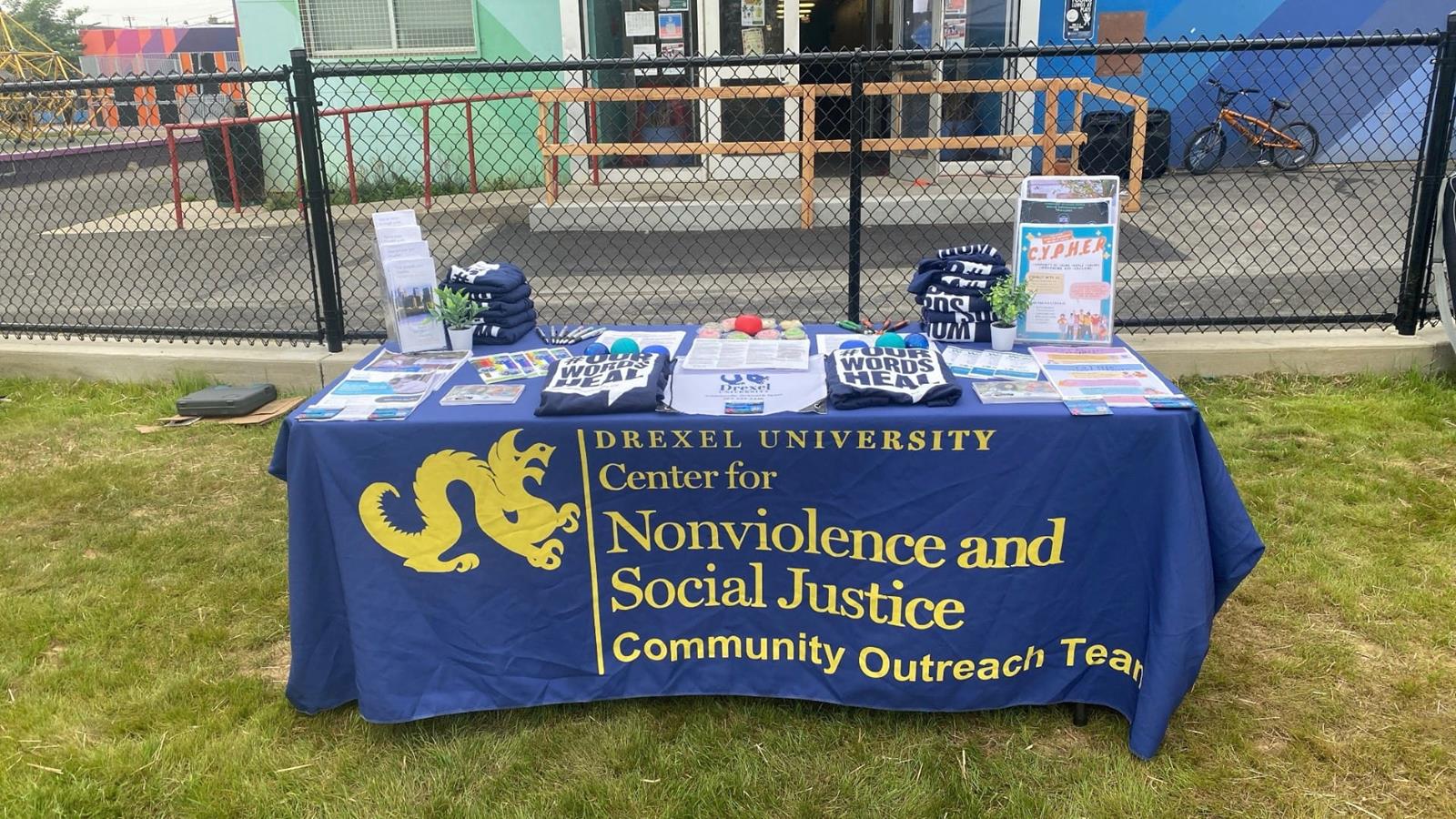 Center for Nonviolence and Social Justice table of resources at an outdoor community event