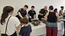 Members of the Drexel University Police Department help serve up a recent community dinner at the Dornsife Center.