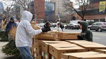 Volunteers help distribute holiday meals through the 52nd Alumni Turkey Project. Photo credit: Marie Kravtsova, film and television major in the Antoinette Westphal College of Media Arts & Design and a photography and video student assistant in the Office of Institutional Advancement.