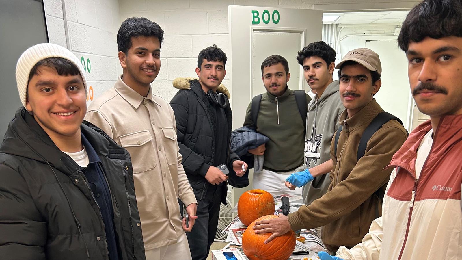 Drexel's English Language Center students carving pumpkins - Fall 2025!