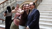 Merlo snaps a selfie with two students