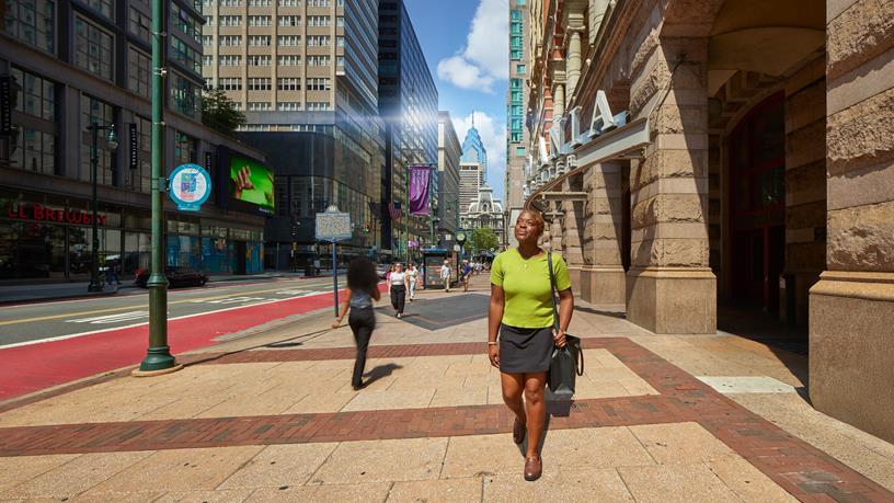 A female student walking through Center City Philadelphia