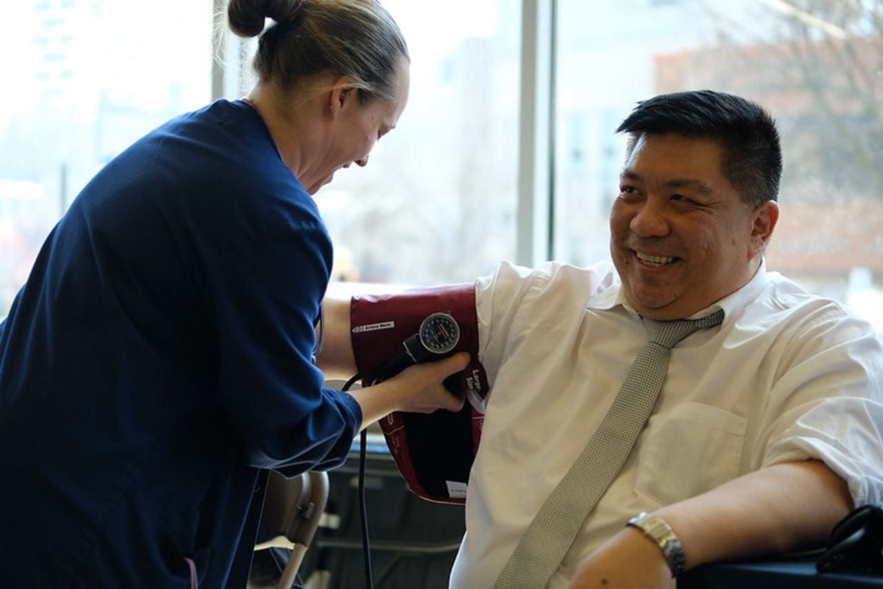 Employee getting their blood pressure checked