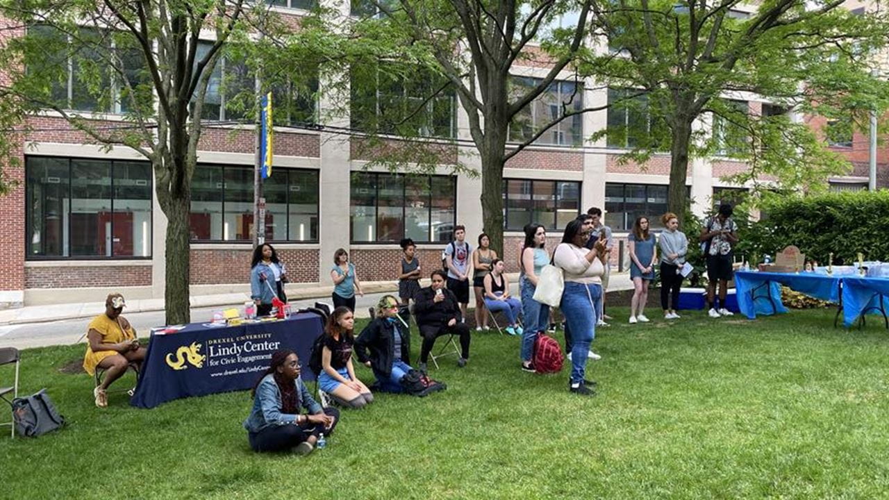 Attendees listen to a speech at the Lindy Center's end-of-year celebration in May 2022