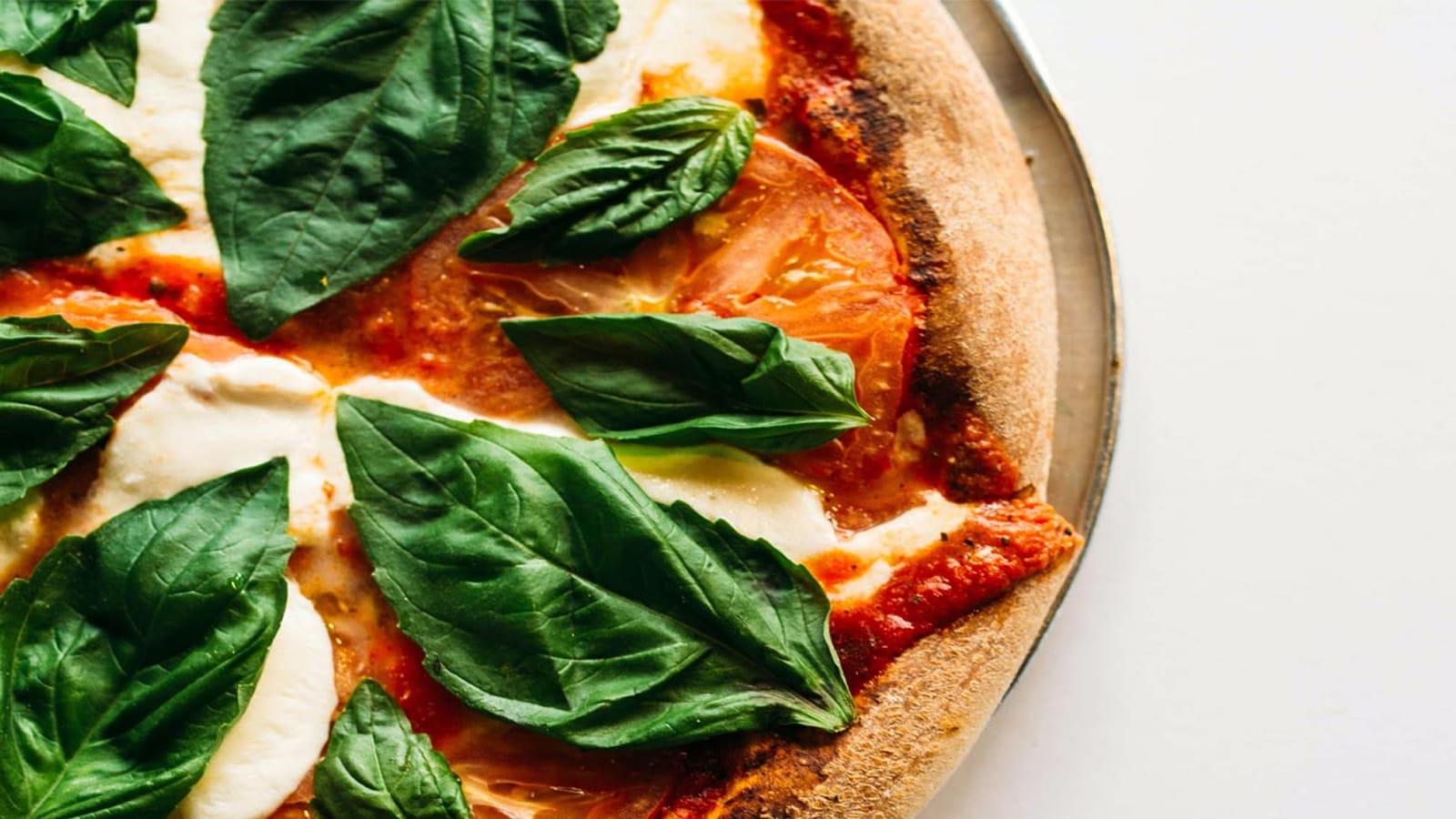 Pizza with fresh basil